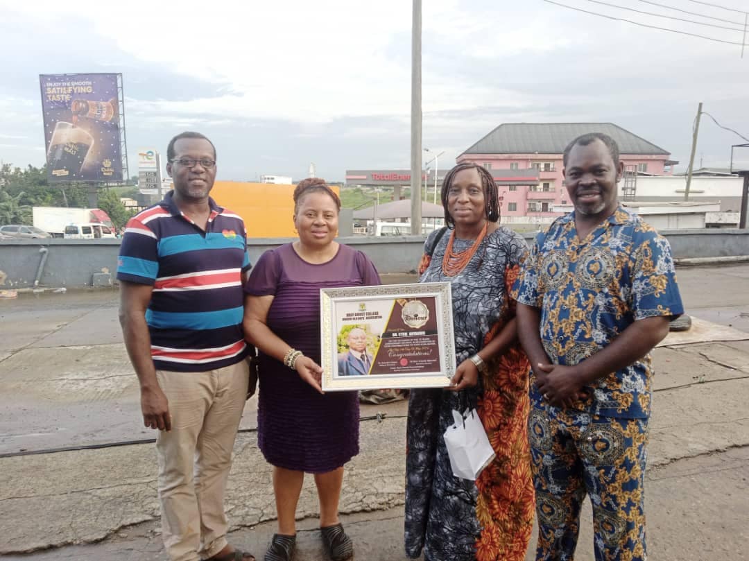 Handing Over Award To Daughter Of Dr. Cyril Anyanwa